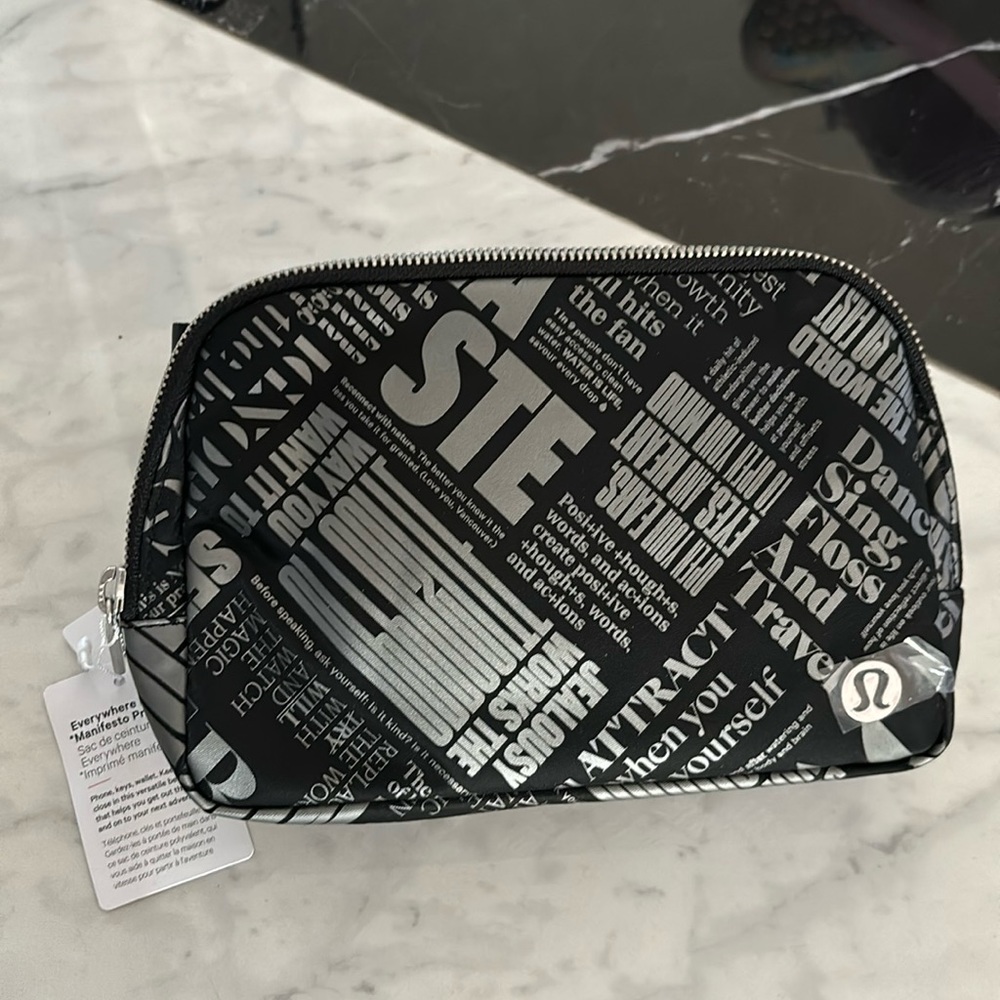 Brand new with tag lululemon black and gray everywhere belt bag manifesto print